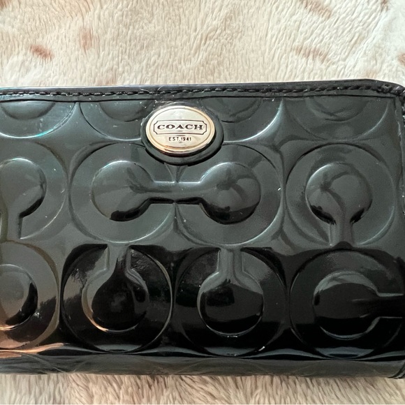 Small black patent leather coach wallet with snap and zipper closure. - Picture 4 of 7